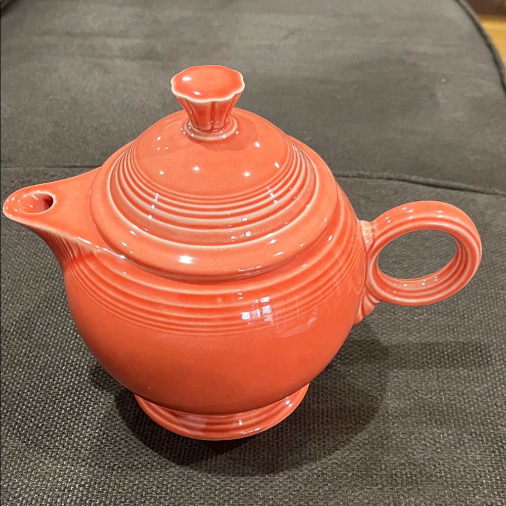 Vibrant salmon/coral Ceramic Teapot I am not sure of the color of this teapot